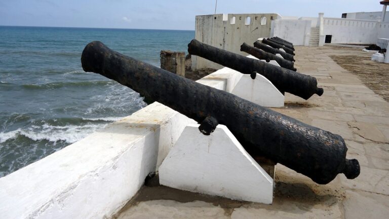 Rows of cannons on the ramparts of Cape Coast Castle overlooking the Atlantic, Ghana