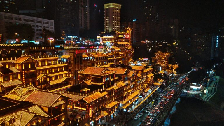 Hongya Cave's stilted buildings glowing at night in Chongqing, China