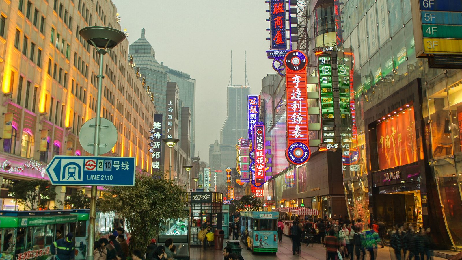 Crowds beneath the neon signs of East Nanjing Road pedestrian street, Shanghai