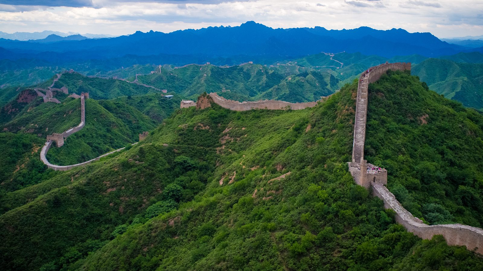 The Great Wall of China winding along ridgelines at Jinshanling