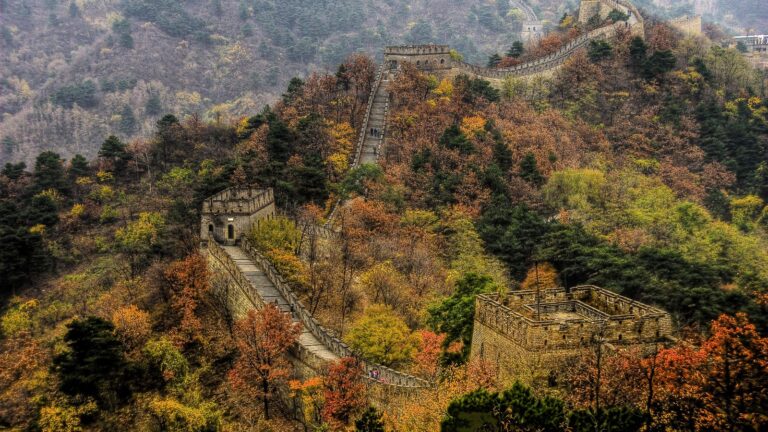 The Great Wall of China at Mutianyu winding over green ridges